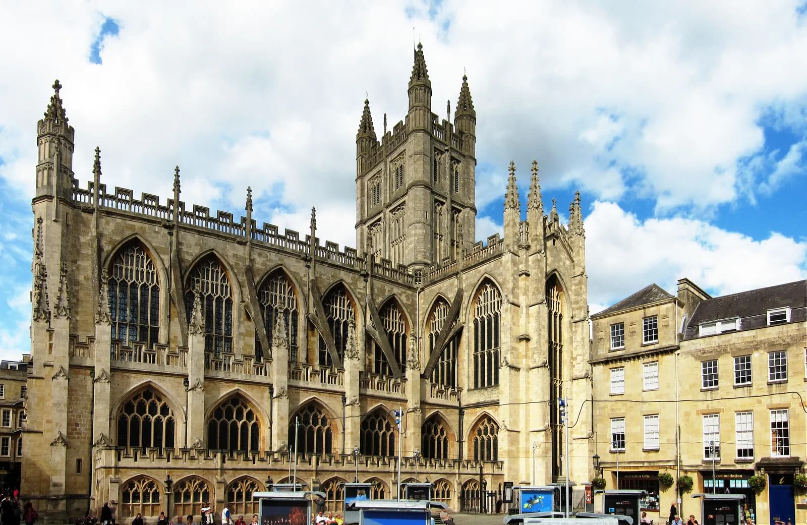 Exterior of Bath Abbey, a medieval church with ornate Gothic stonework, photographed in daylight.