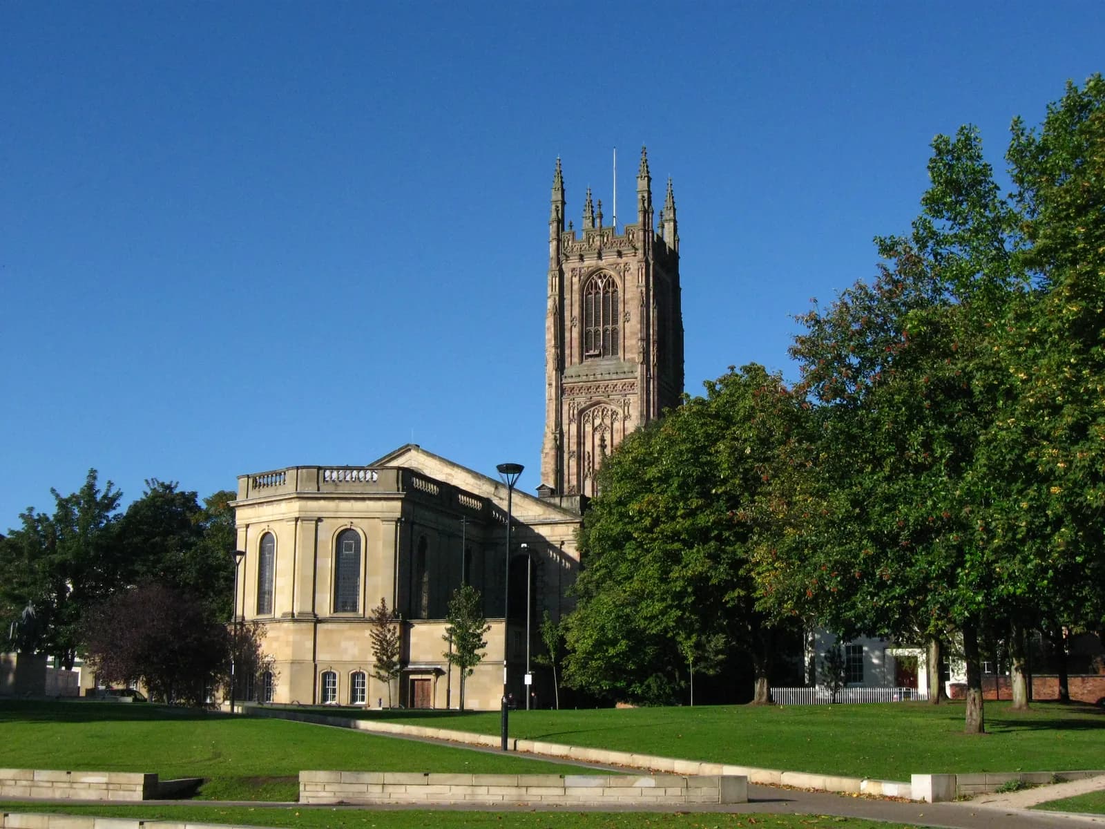 Derby Cathedral seen from Cathedral Green, its tower rising above the nave.