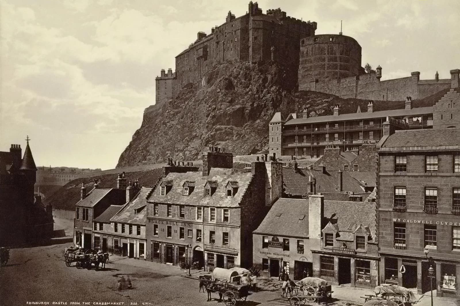Edinburgh Castle on its volcanic crag, seen from the Grassmarket.