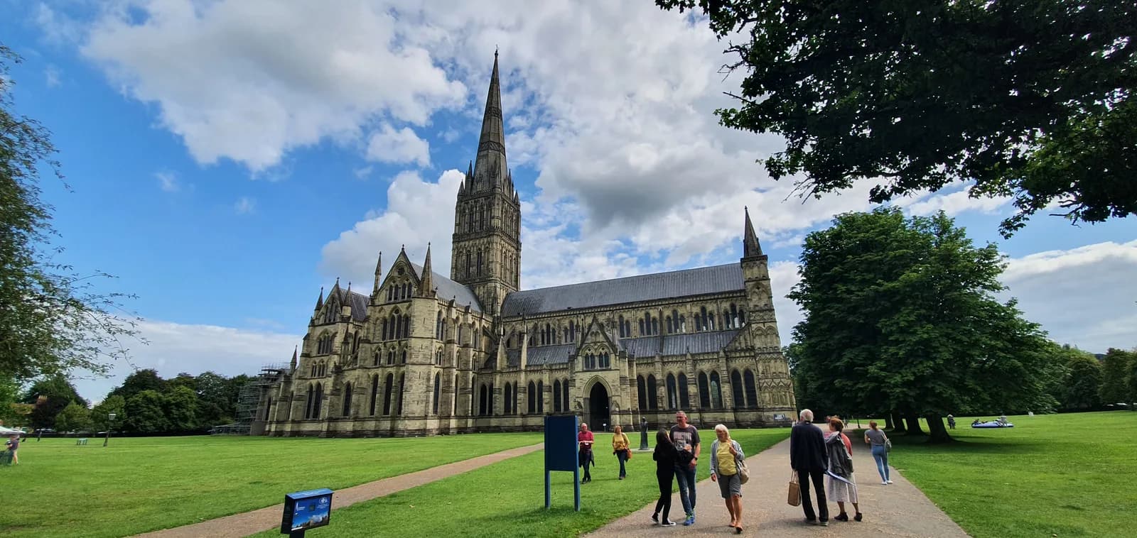 Salisbury Cathedral and its tall spire seen from the High Street.
