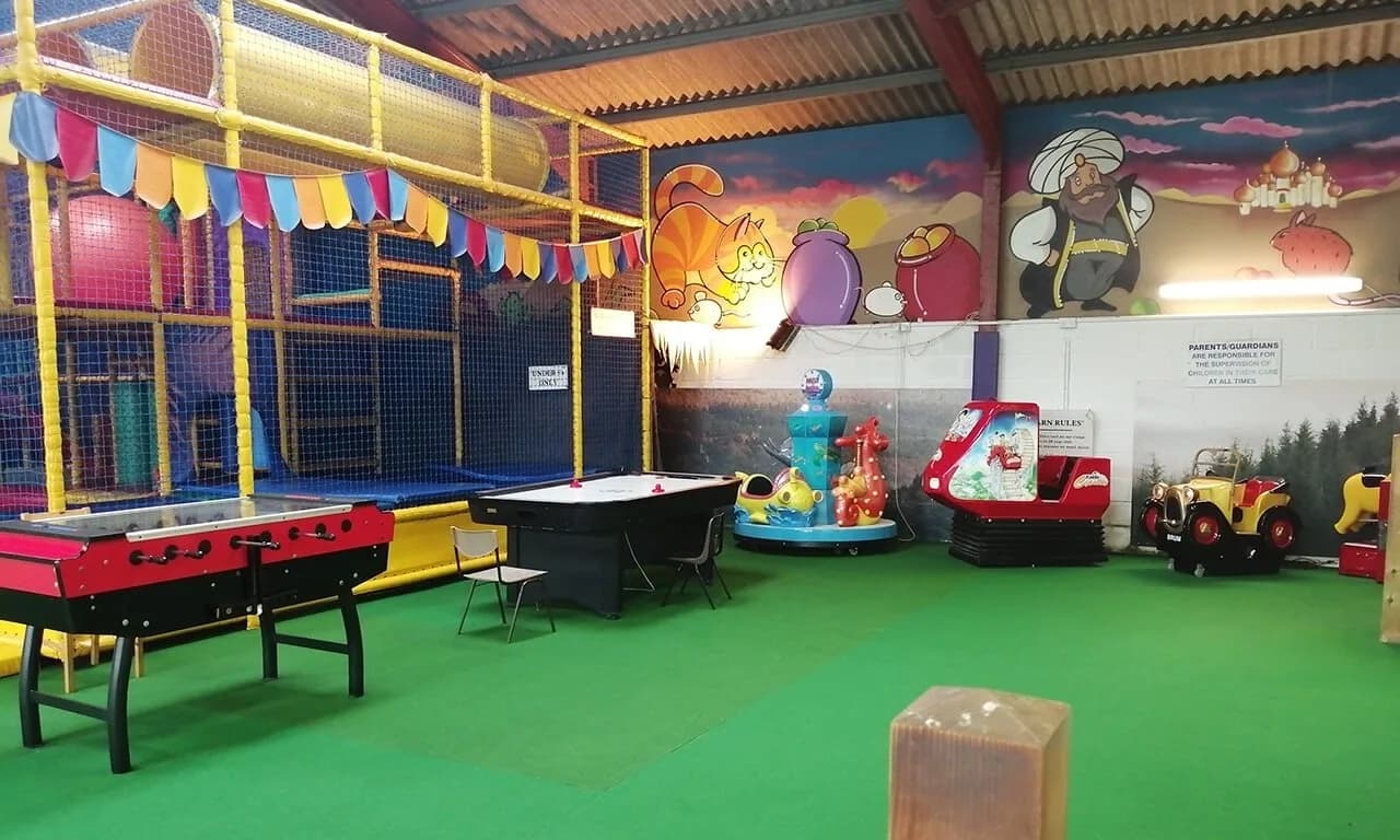 Indoor soft play barn with slides and play equipment at Dick Whittington Park