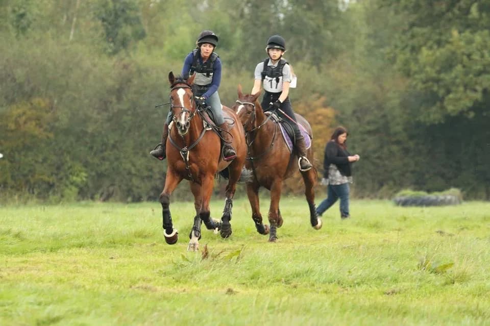 Riders on horseback during a riding lesson at Rein & Shine, Braydon