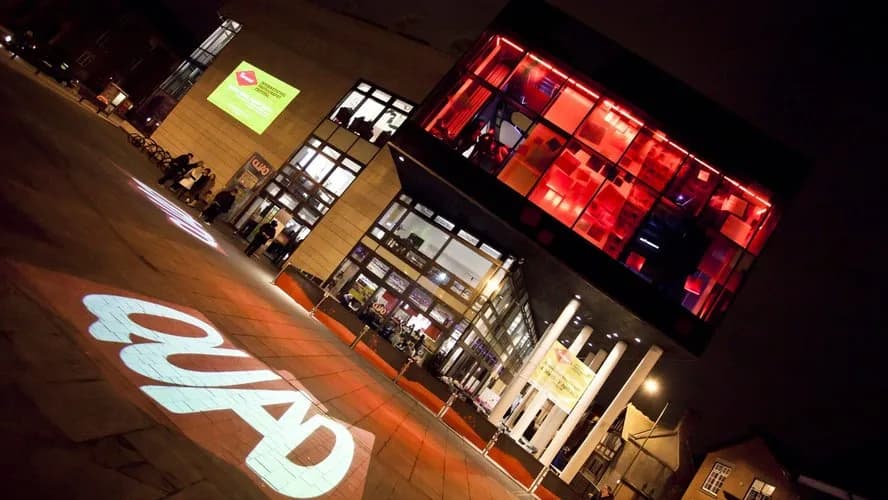 QUAD Derby building exterior lit up at night on Market Place