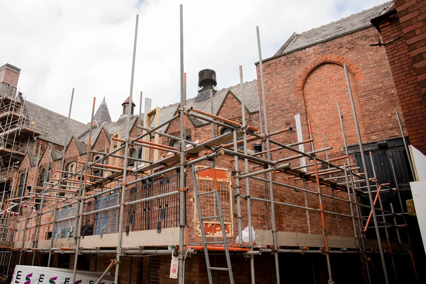 The Stephenson Memorial Hall (Pomegranate Theatre) under refurbishment, viewed from Station Back Lane, Chesterfield