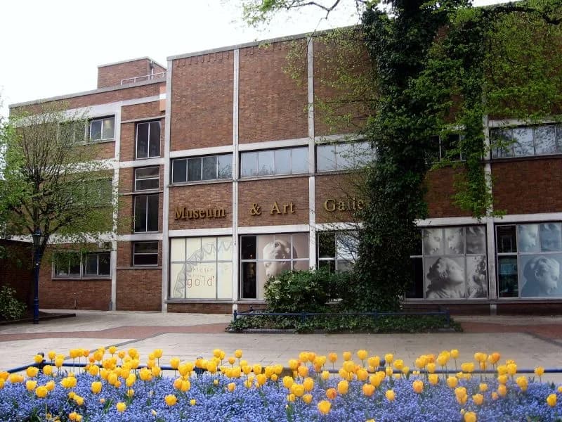 Derby Museum and Art Gallery building exterior with flower beds