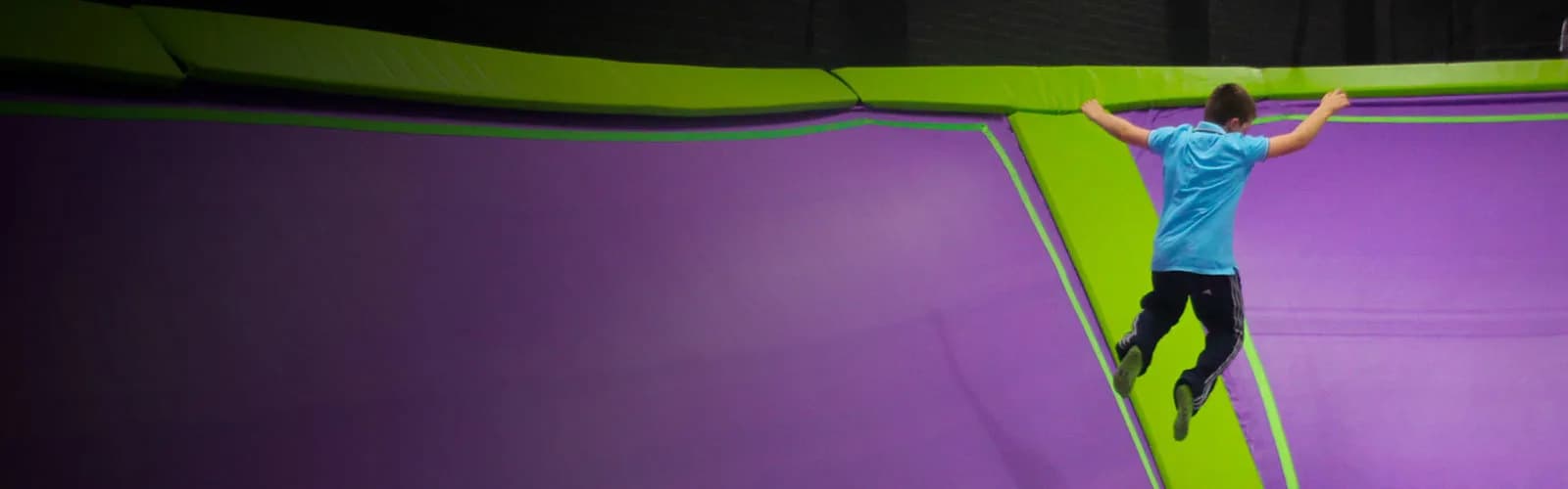 Jumper mid-air on trampolines at Jump Giants Loughborough trampoline park