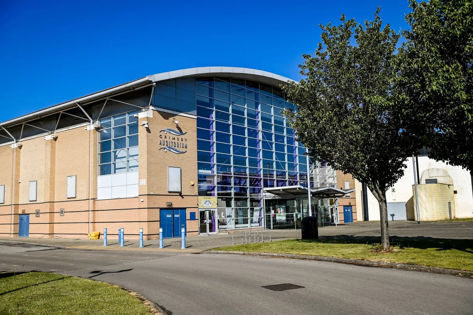 Grimsby Auditorium exterior - curved glass frontage and main entrance on Cromwell Road, Grimsby
