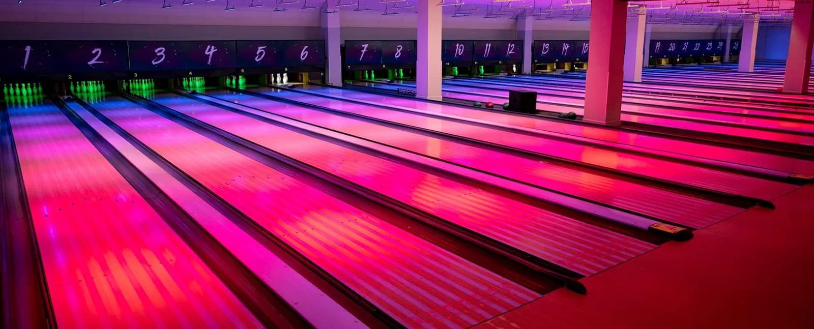 Neon-lit bowling lanes at Tenpin Northampton