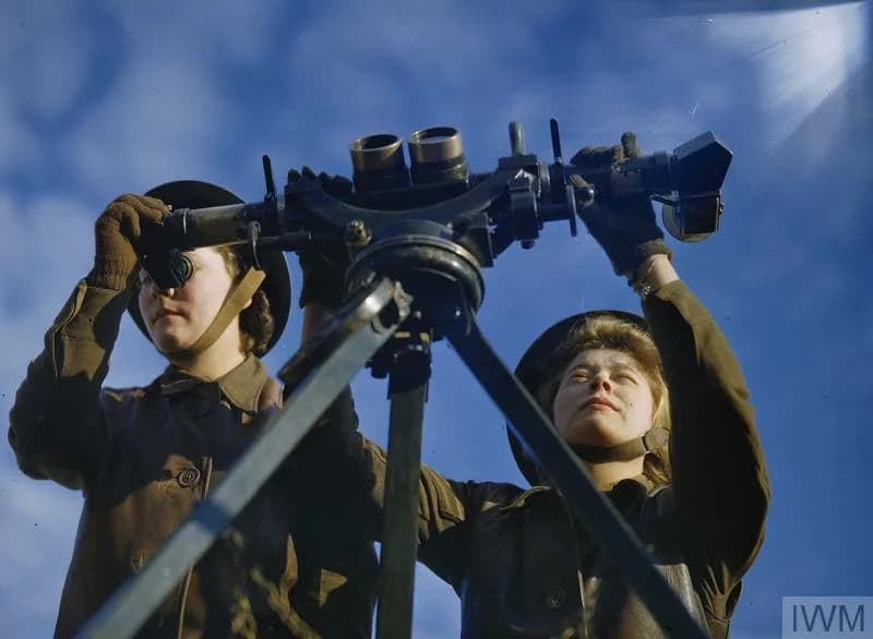 Visitors looking up at a B-17 Flying Fortress in the American Air Museum at IWM Duxford