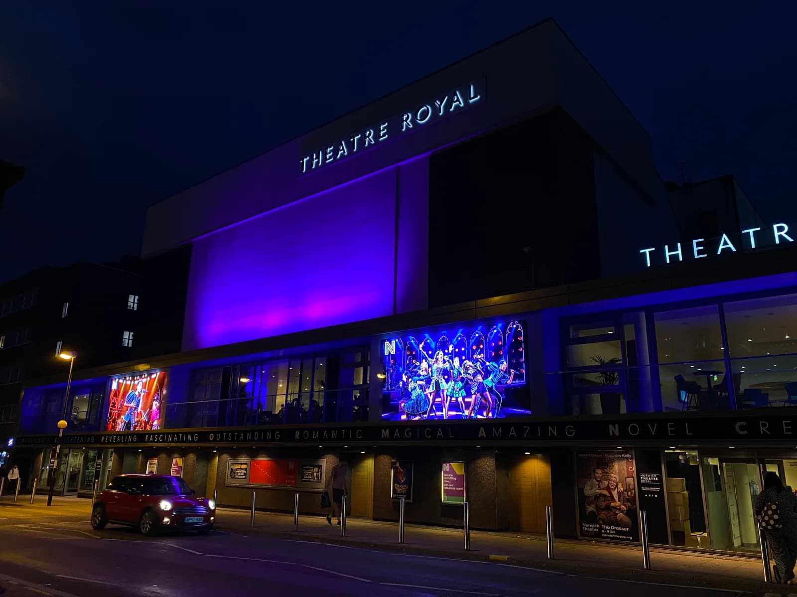 Exterior frontage of Norwich Theatre Royal lit up at night