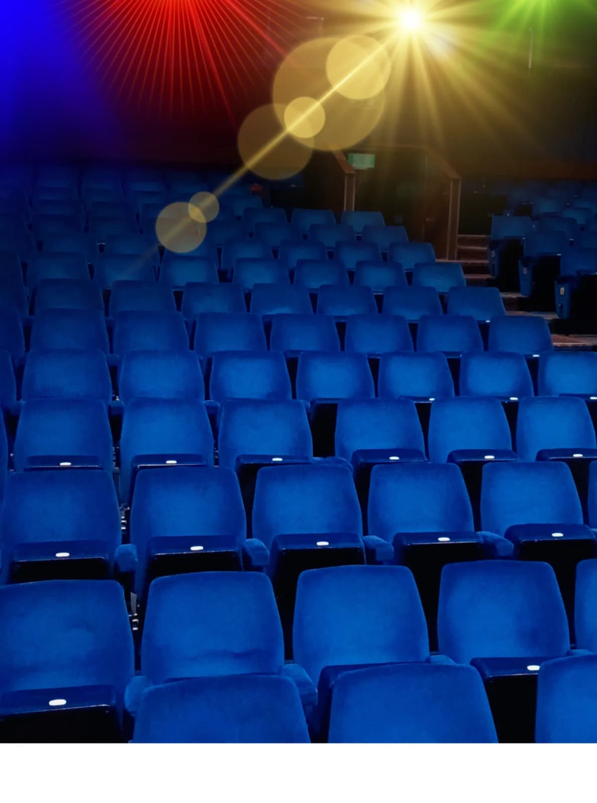 Luton Library Theatre auditorium interior with royal blue seating and stage lighting