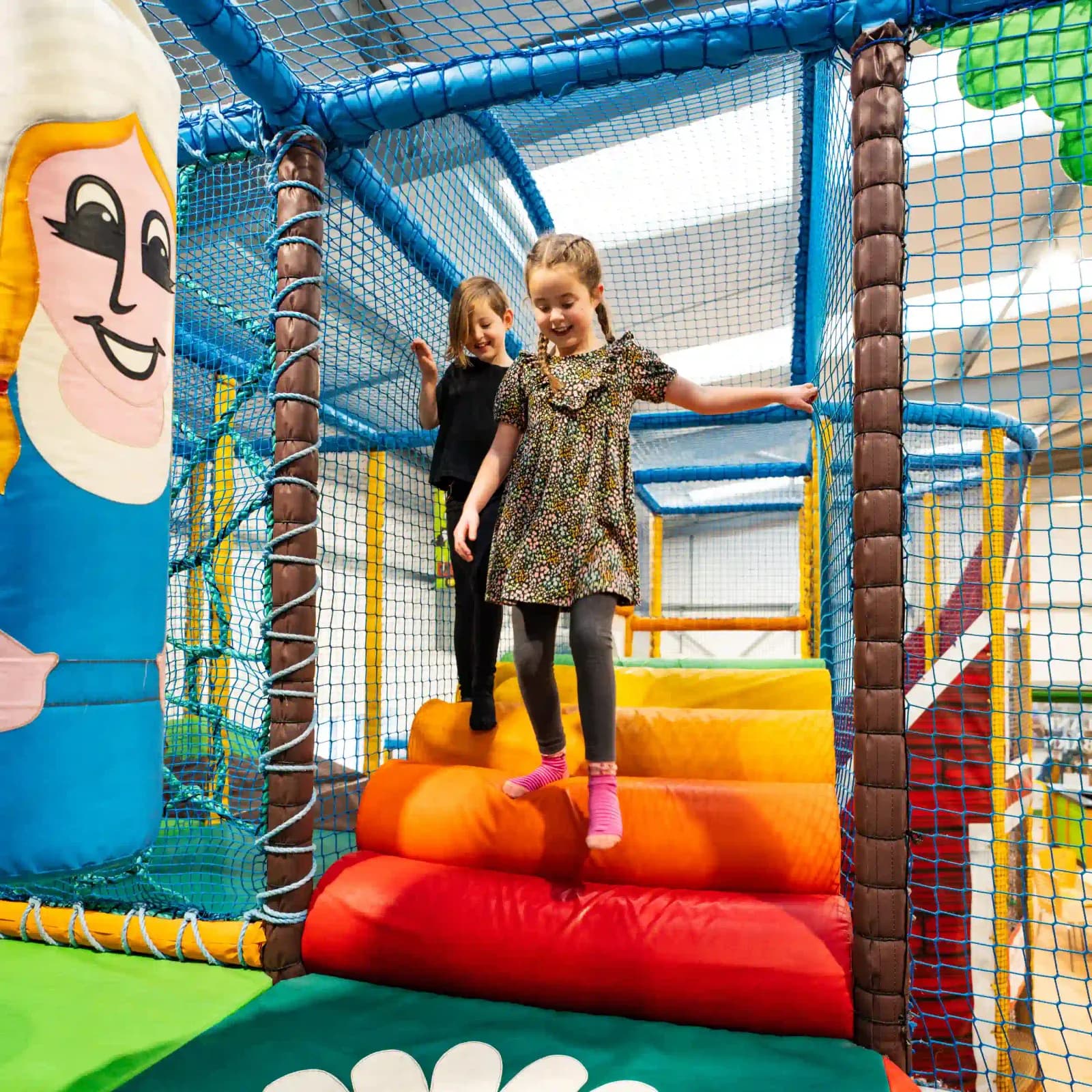 Indoor soft play area at Bury Lane Fun Barn with multi-level play structures
