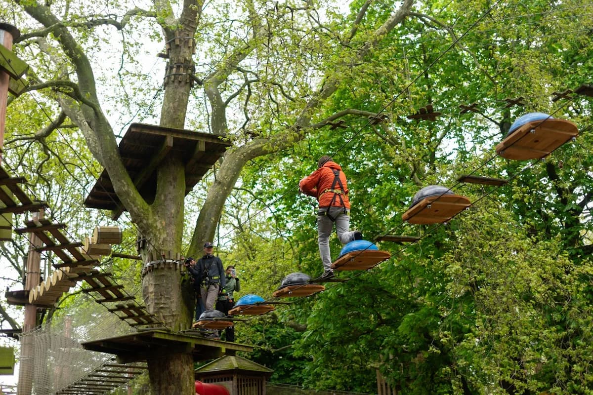 Person crossing a high ropes course at Go Ape Battersea Park