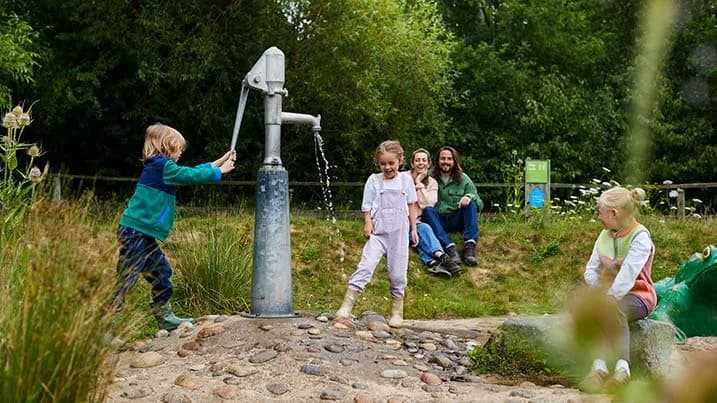 Children playing in the water play area at WWT Washington Wetland Centre