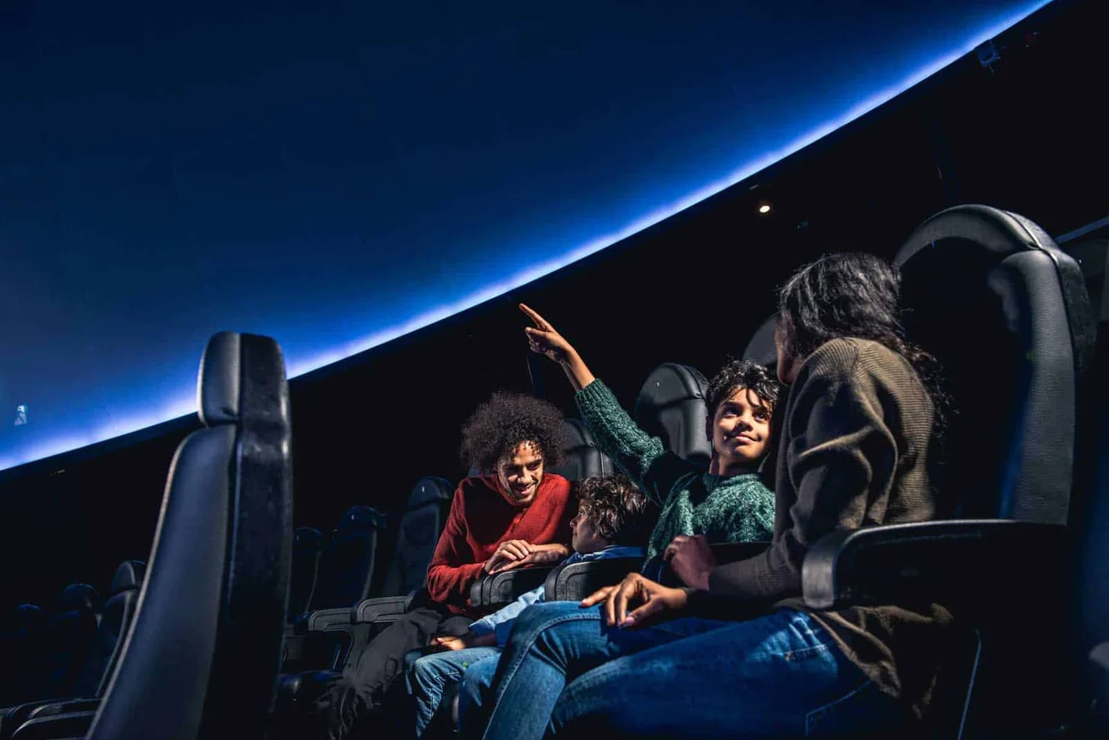Family watching a planetarium show in the Space Zone at Life Science Centre, Newcastle