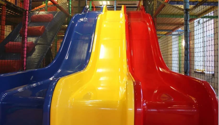 Three-lane astra slide and soft play frame inside Go Wild Bury Play Centre, Bury
