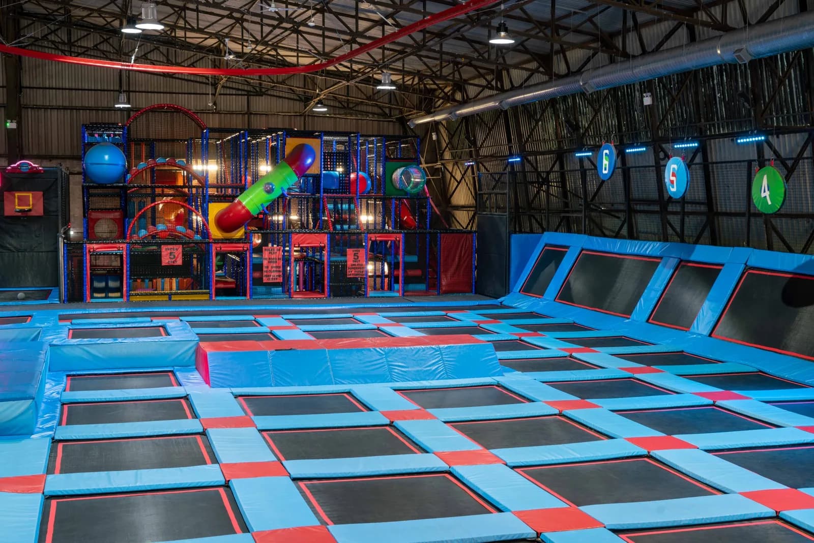 Trampoline area at Fusion Trampoline Park Carlisle showing jumpers on trampolines