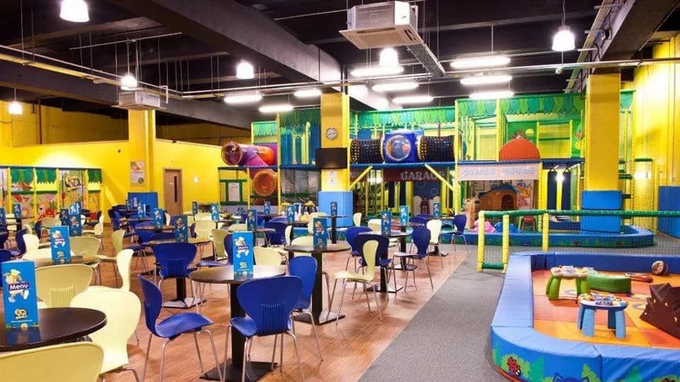 Indoor soft play area at Funky Monkeys Cityside Belfast showing the main play structure with tunnels and slides