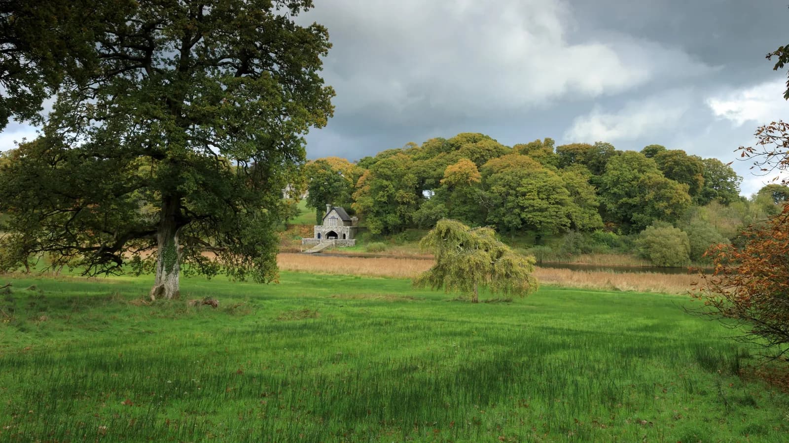 Boathouse and parkland on the shores of Upper Lough Erne at Crom Estate