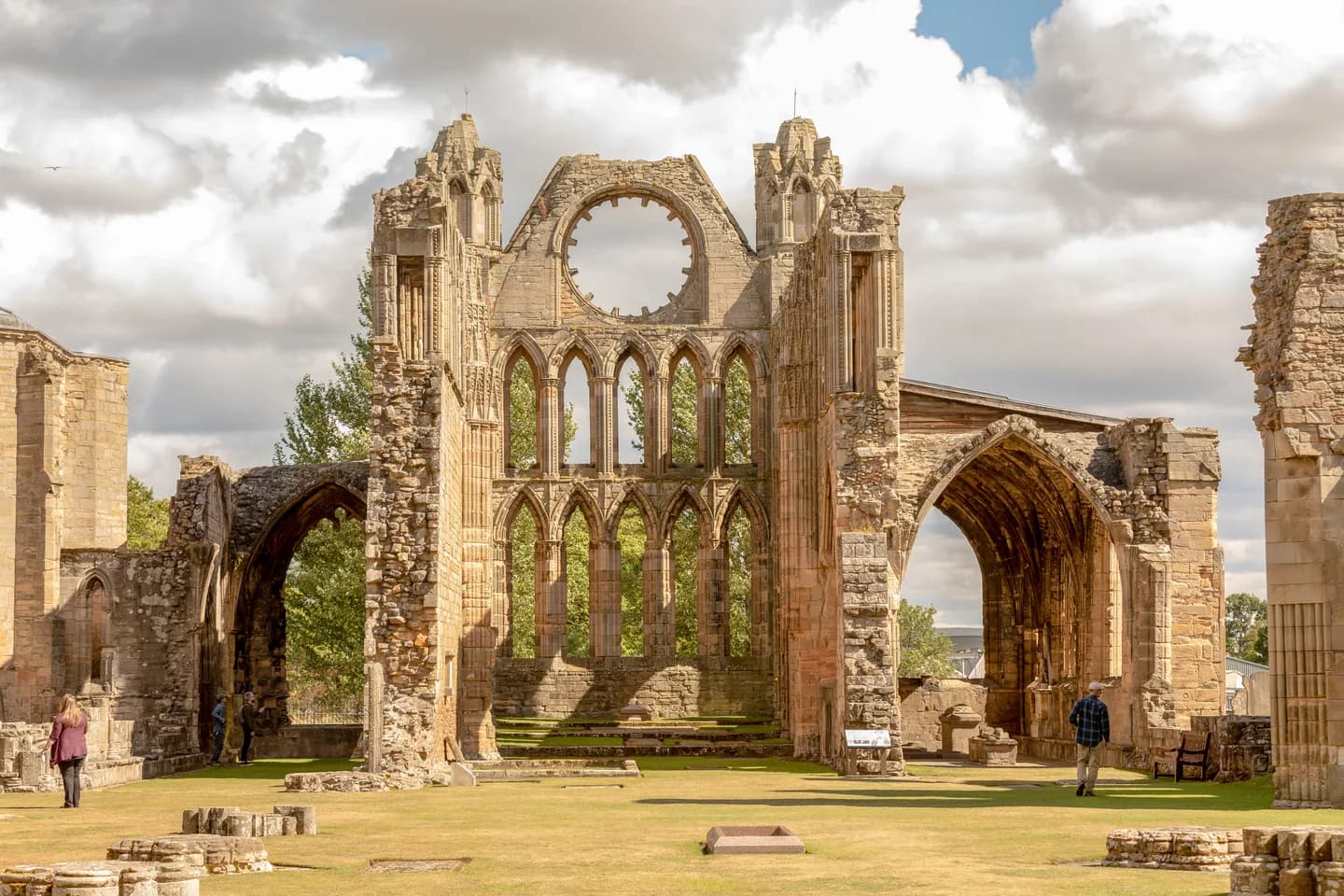 Panoramic view of Elgin Cathedral ruins showing the east window and surrounding grounds