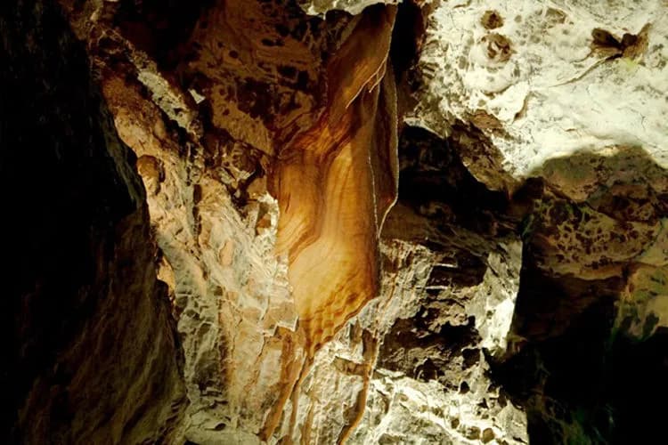 Dan-yr-Ogof Showcave entrance with waterfall