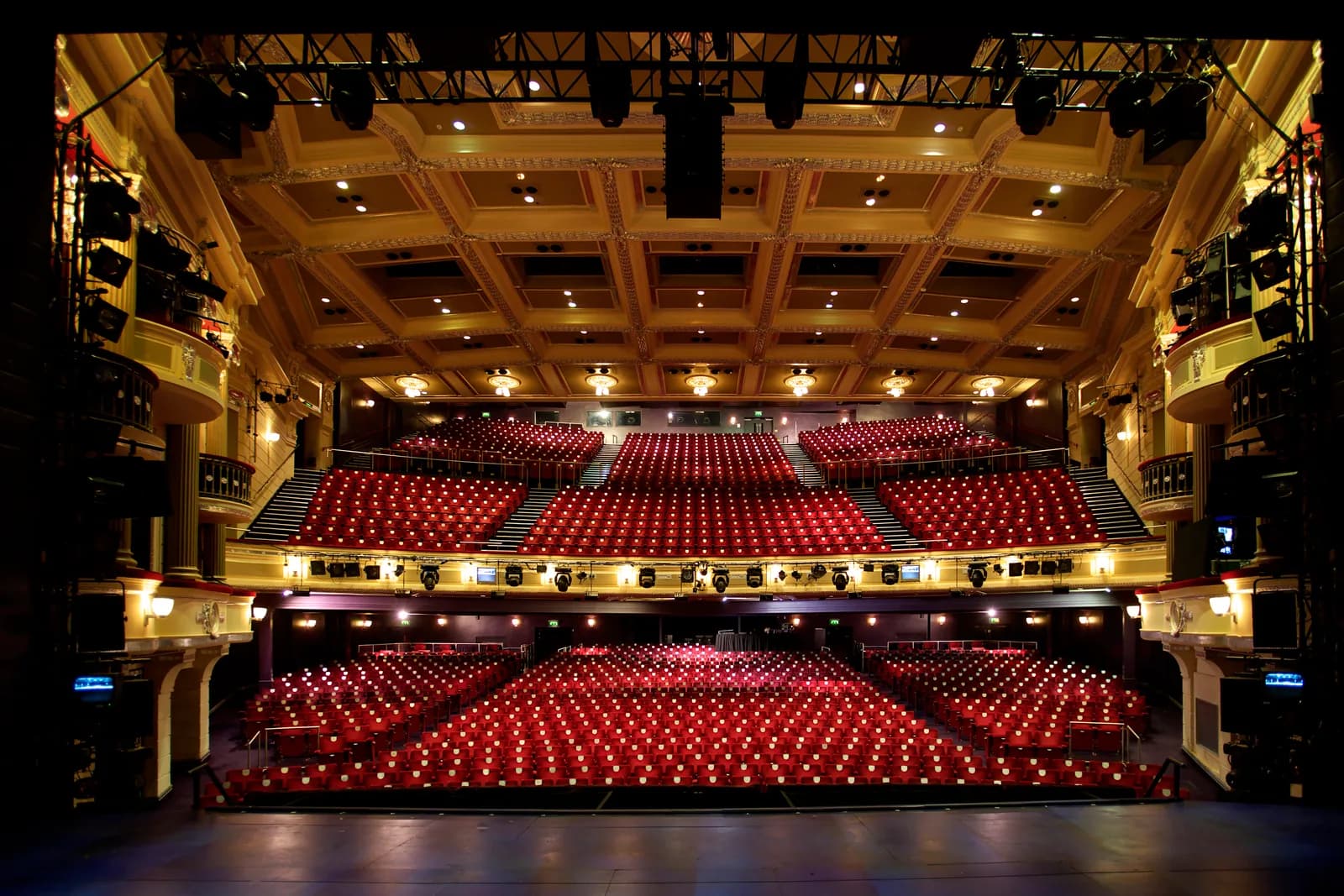Interior view of the Birmingham Hippodrome theatre auditorium with red seats and stage