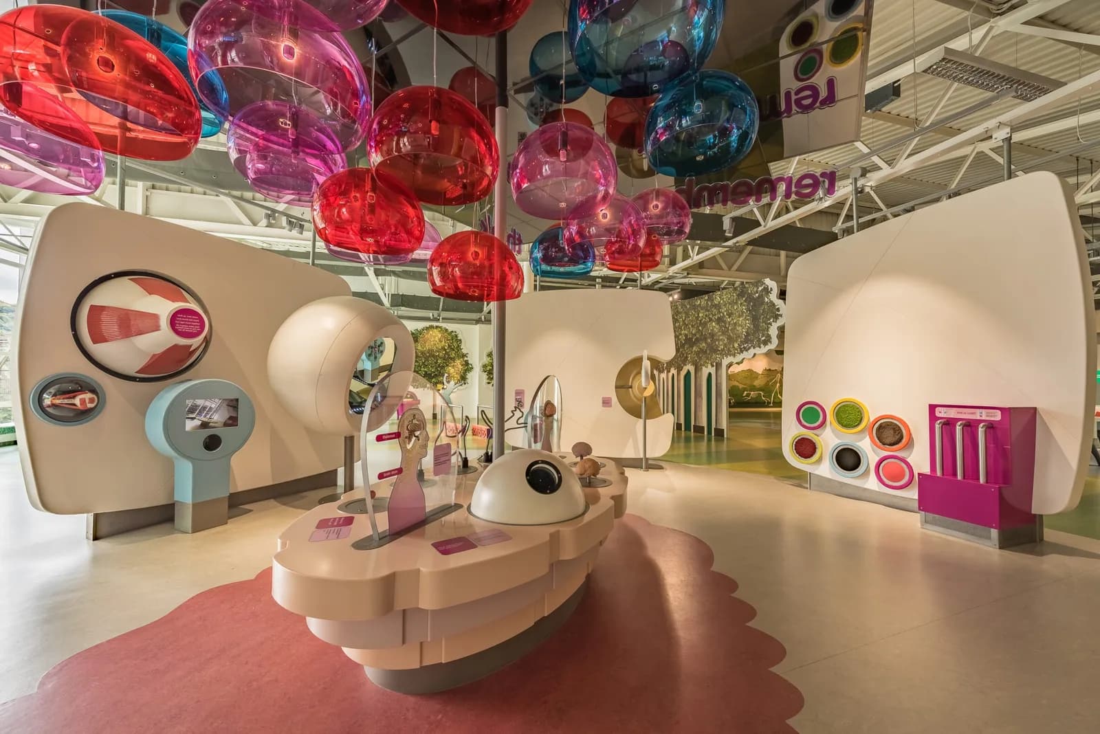 Inside Eureka! The National Children's Museum in Halifax: the All About Me gallery with giant eye and ear exhibits and colourful hanging spheres