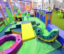 Children playing in the three-tier soft play structure at East End Pool