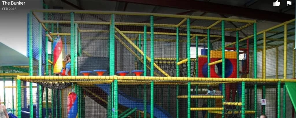 Two-storey indoor soft play area at The Bunker Seahouses with slides, ball pools and climbing frames