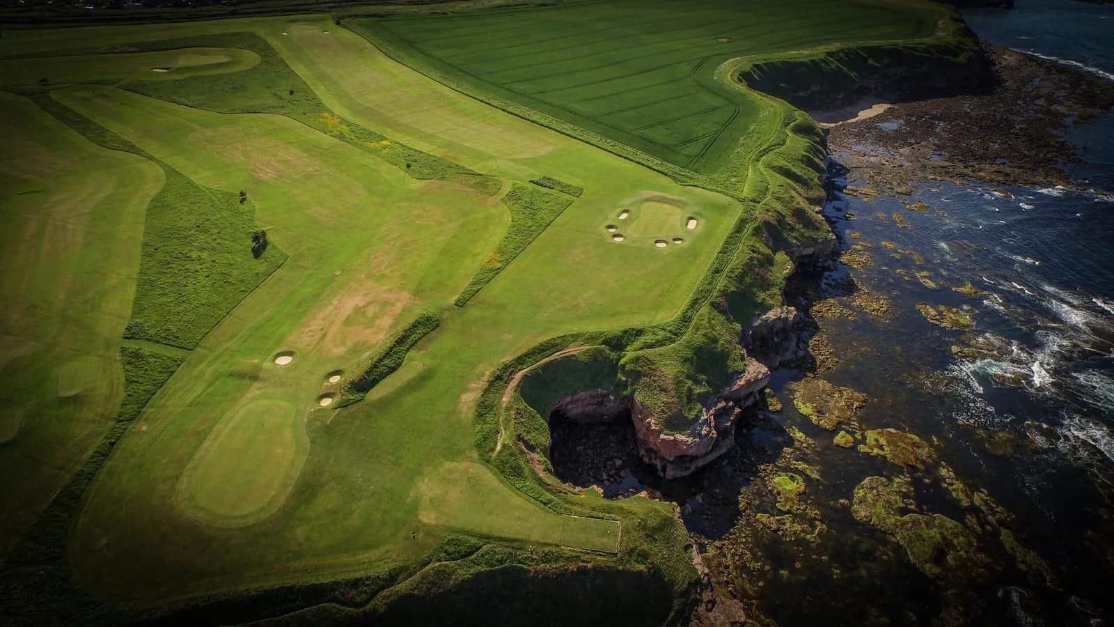 Aerial view of Magdalene Fields Golf Course showing the 8th hole with coastal views