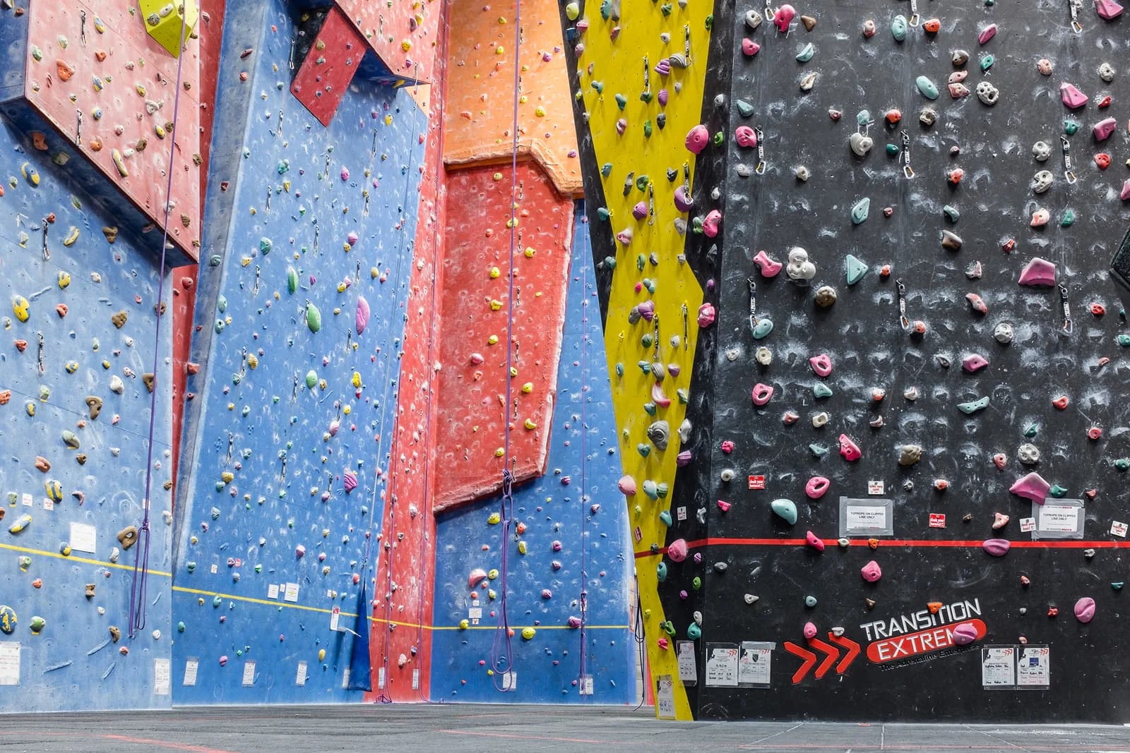 Indoor climbing wall at Transition Extreme, Aberdeen — colourful bouldering and roped climbing walls