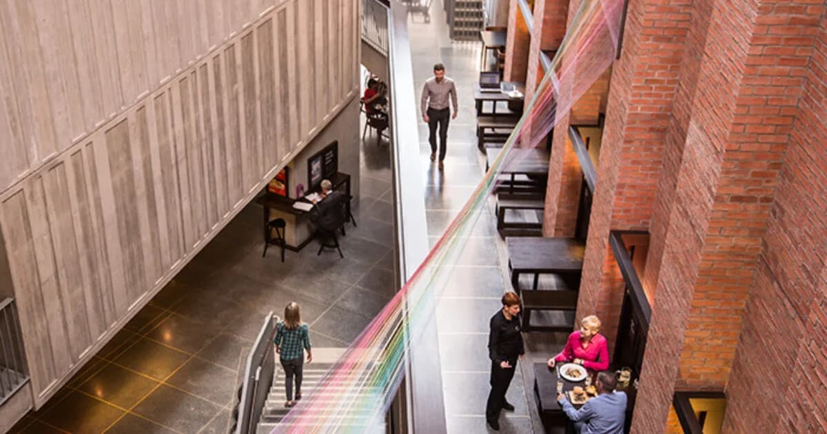 View inside The MAC Belfast gallery atrium with its rainbow thread installation