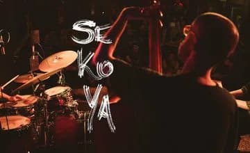 Live music performance at Traverse Theatre, drummer on stage with audience in the dark