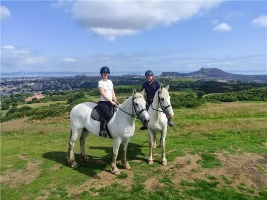 Riders on a scenic Braid Hills ride at Tower Farm Riding Stables, Edinburgh
