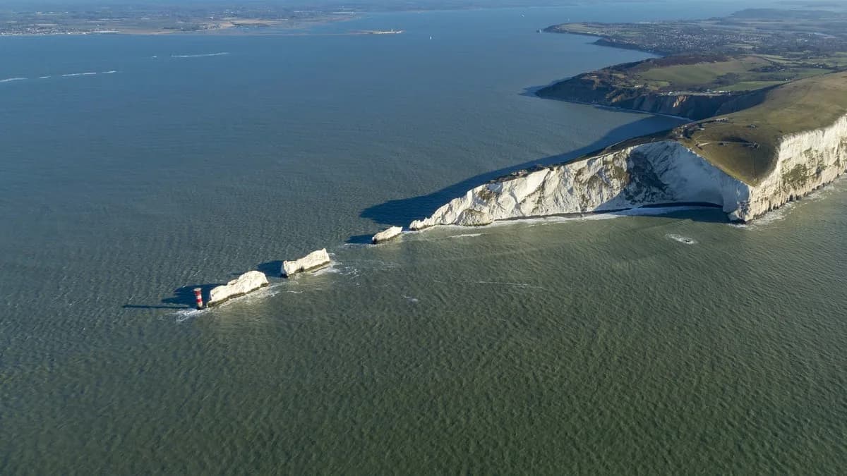 Aerial view of The Needles chalk stacks and Tennyson Down headland, Isle of Wight