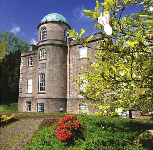 Historic Armagh Observatory building with its copper dome and gardens