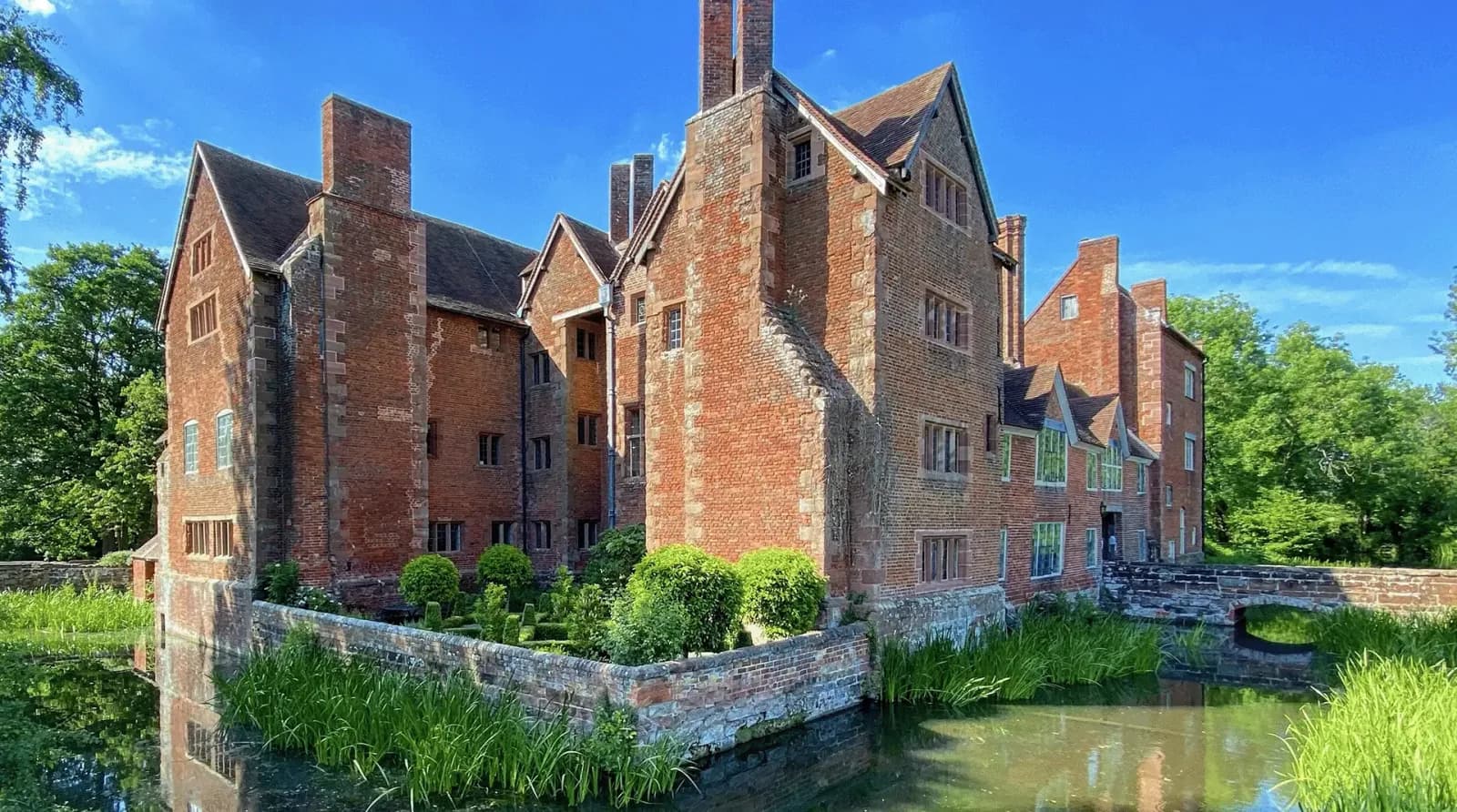 The moated Elizabethan manor house of Harvington Hall in Worcestershire