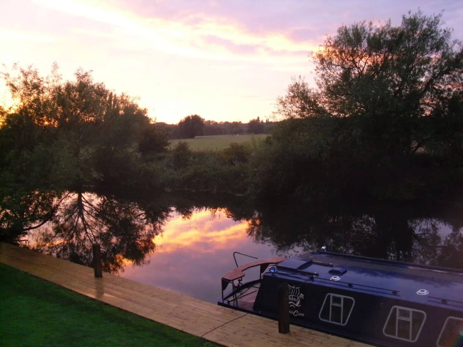 The Artful Dodger barge on the River Great Ouse at Danish Camp, Willington