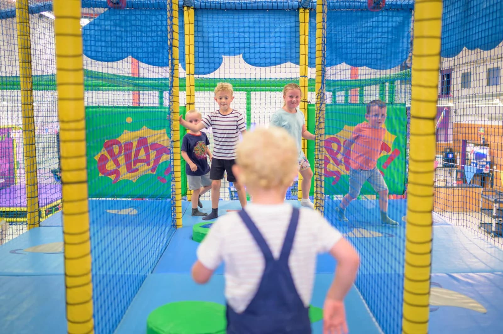 Children playing on the multi-level soft play frames at Partyman World Ipswich