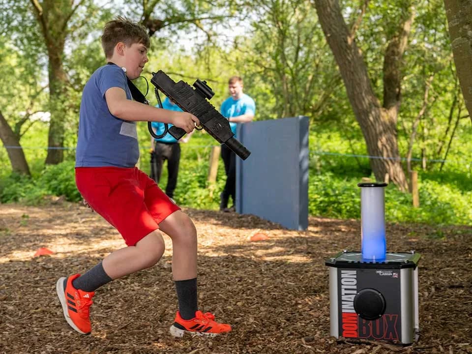 Children playing laser tag in the woodland ZAPT Zone at Milton Country Park, Cambridge